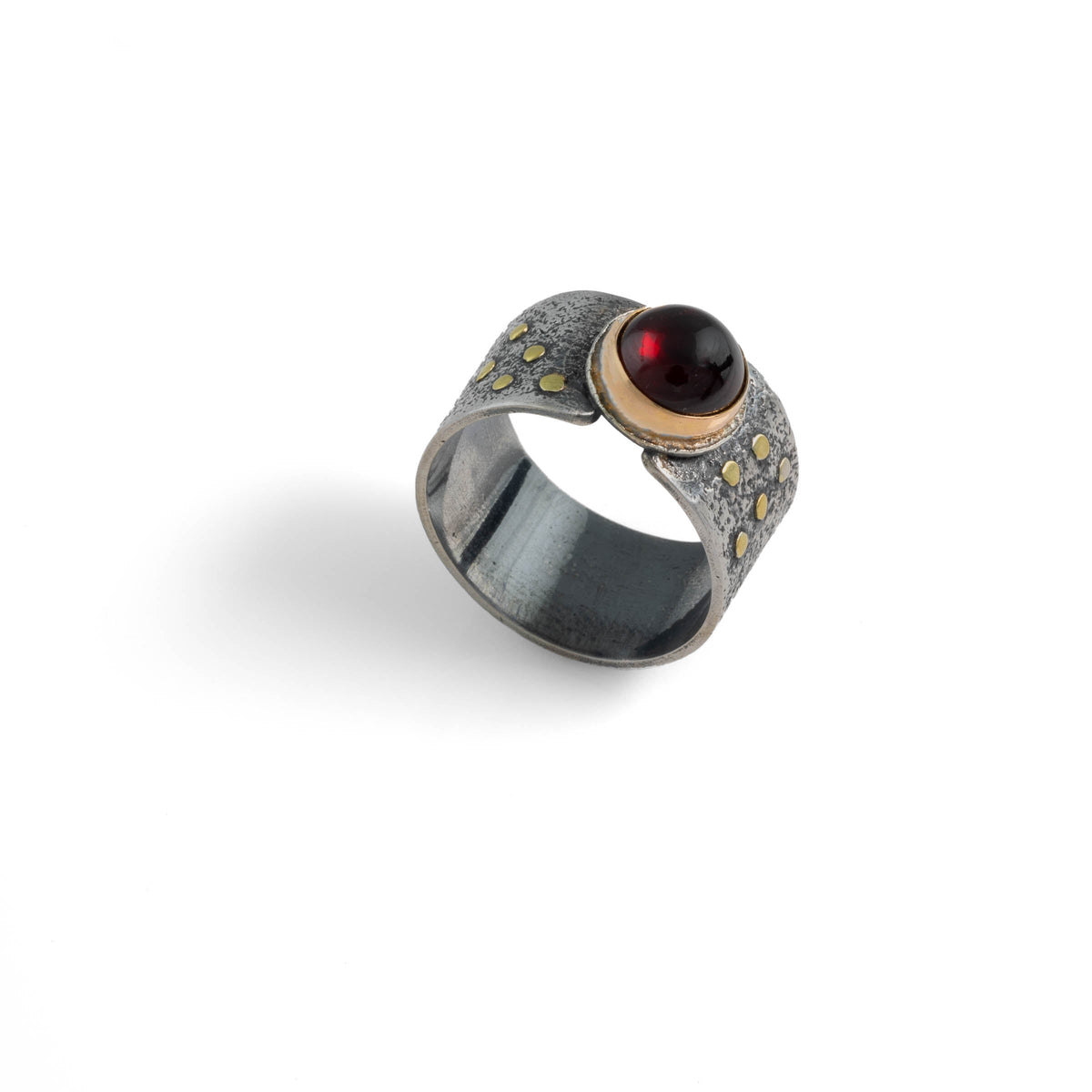 Van Gogh-inspired statement ring, handcrafted from oxidized sterling silver with 18K gold elements and an 8mm garnet surrounded by a 14K gold band.