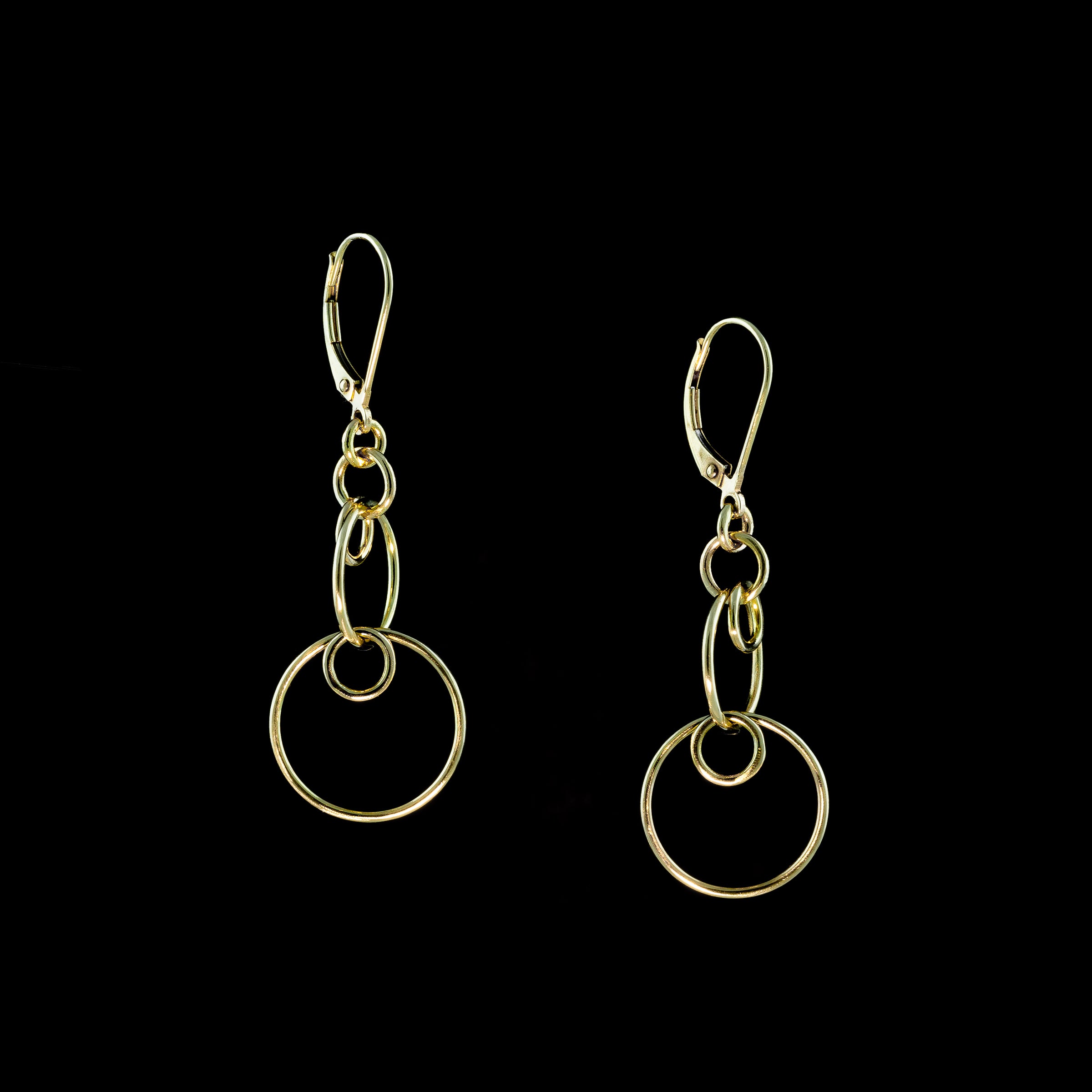 Hand-fabricated, contemporary dangle earrings in either 14K gold or sterling silver.