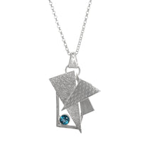 Contemporary-design pendant necklace, hand fabricated from Argentium sterling silver with a 5mm London Blue Topaz. 