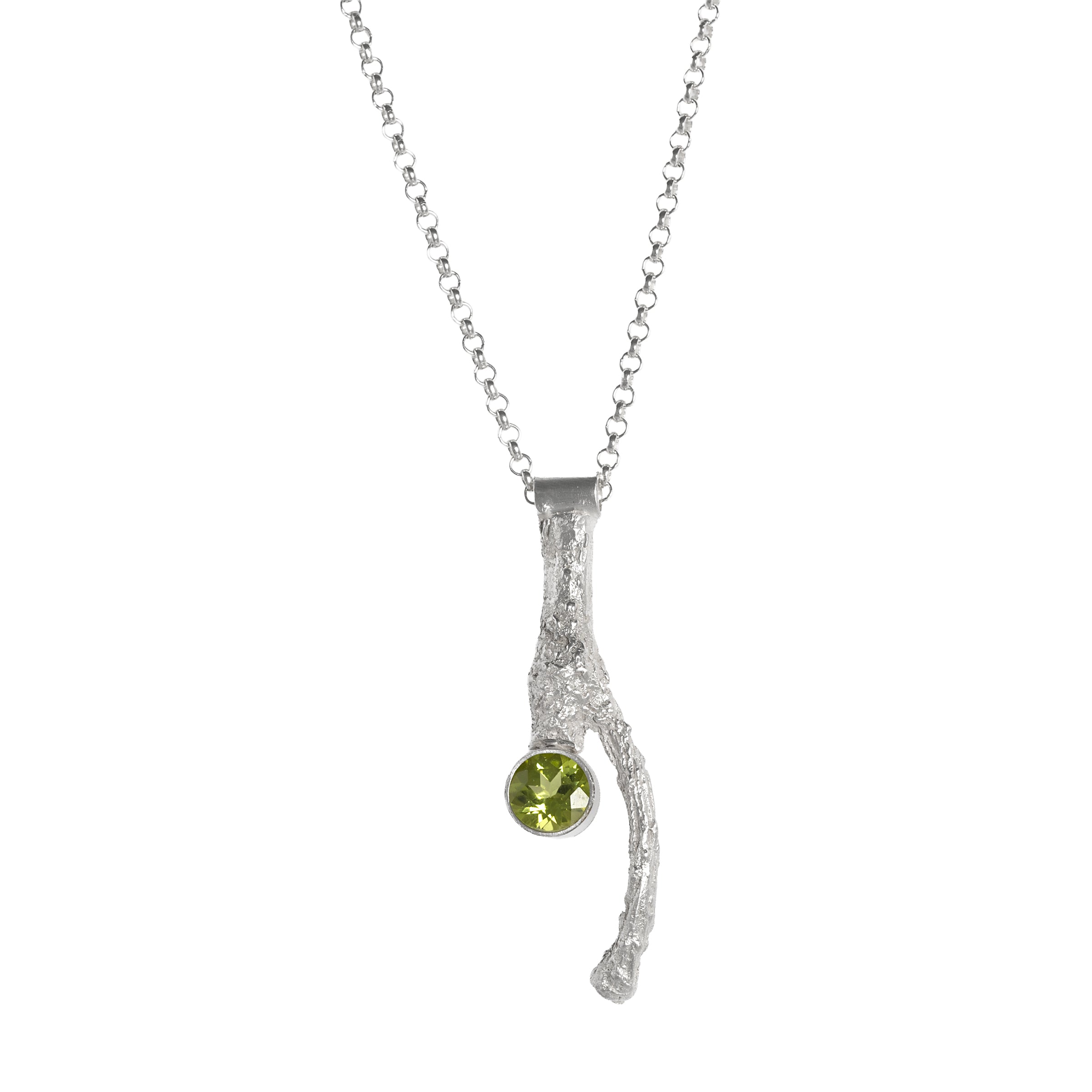 Handcrafted, one-of-a-kind pendant necklace featuring an organic casting of a twig in sterling silver, highlighted by a 6mm green peridot.