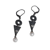 Contemporary geometric design dangle earrings, hand-fabricated in oxidized sterling silver and highlighted by freshwater pearls and white topaz. 