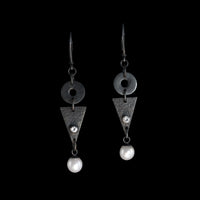 Contemporary geometric design dangle earrings, hand-fabricated in oxidized sterling silver and highlighted by freshwater pearls and white topaz. 