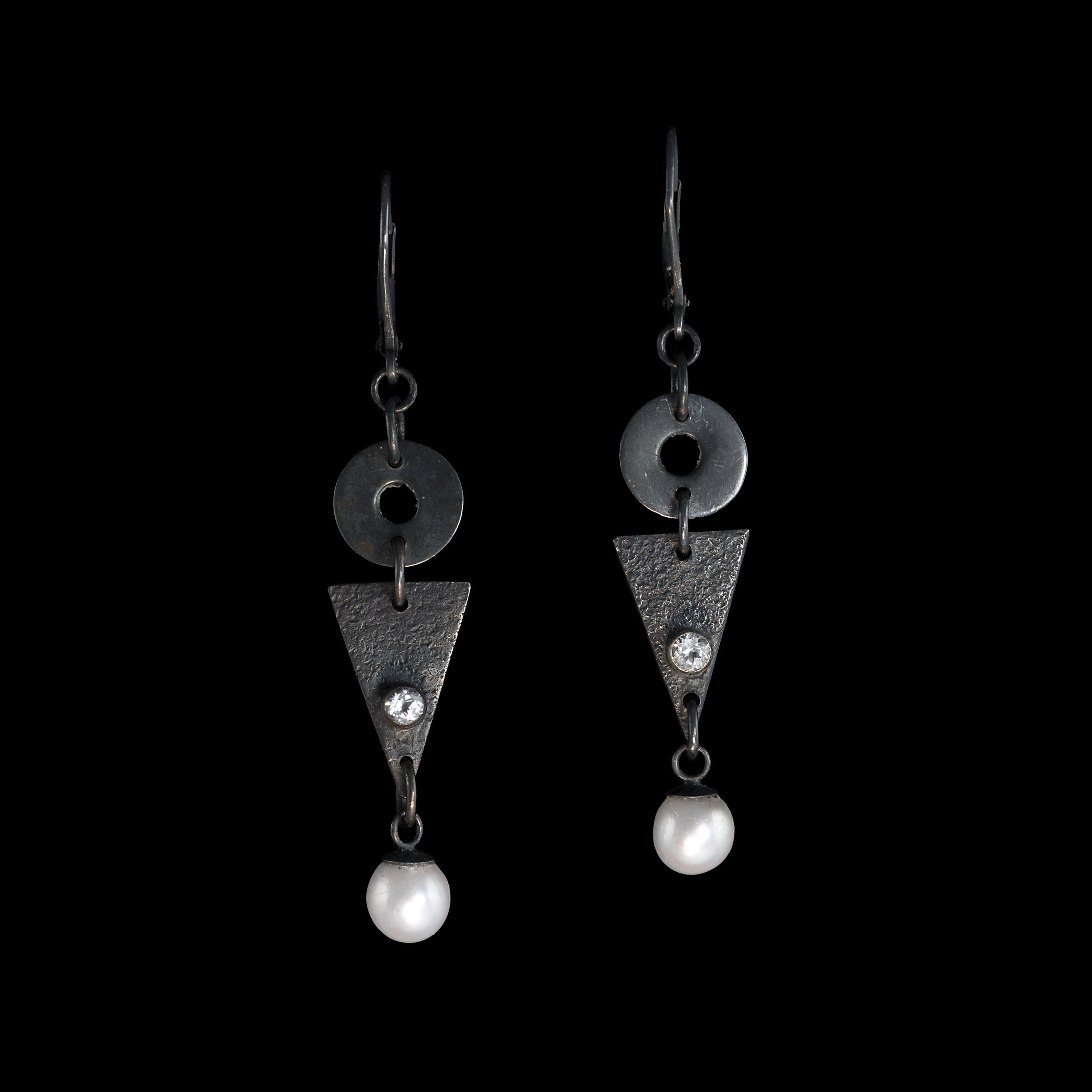 Contemporary geometric design dangle earrings, hand-fabricated in oxidized sterling silver and highlighted by freshwater pearls and white topaz. 