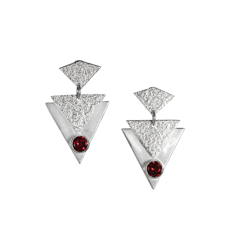 Contemporary, geometric design post earrings, hand-fabricated in sterling silver and featuring deep red garnets.