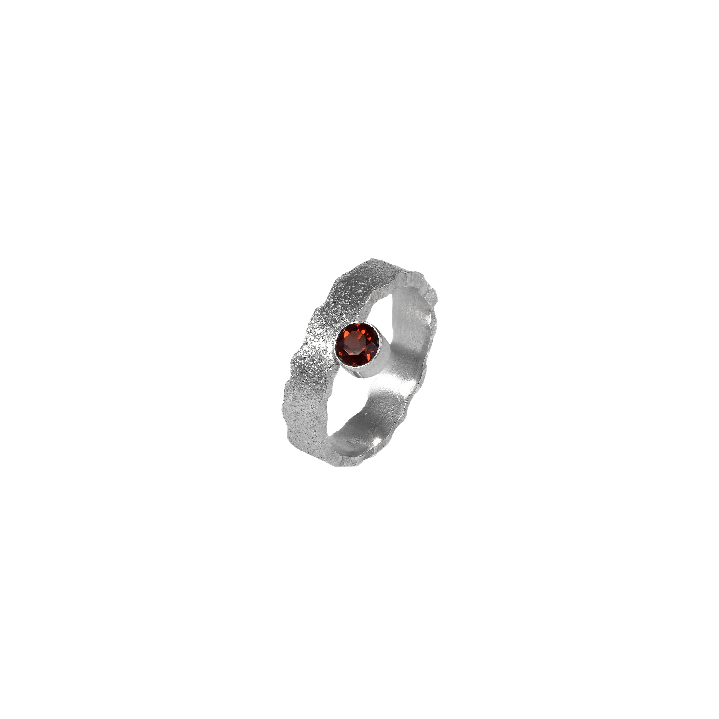 Hand-fabricated, sterling silver ring highlighted by a 4mm deep garnet red gemstone.