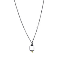 Geometric design pendants, handcrafted with Argentium sterling silver and green peridots set in 18K gold bezels.  Sterling silver chain.
