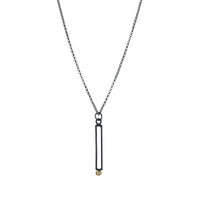 Geometric design pendants, handcrafted with Argentium sterling silver and green peridots set in 18K gold bezels.  Sterling silver chain.
