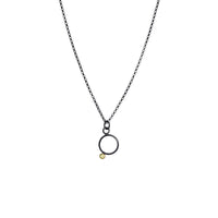 Geometric design pendants, handcrafted with Argentium sterling silver and green peridots set in 18K gold bezels.  Sterling silver chain.