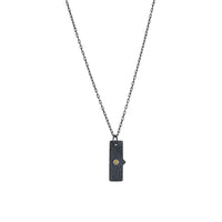 Oxidized argentium sterling silver and 18K gold charm pendant necklace with contemporary geometric styling in a layered look.
