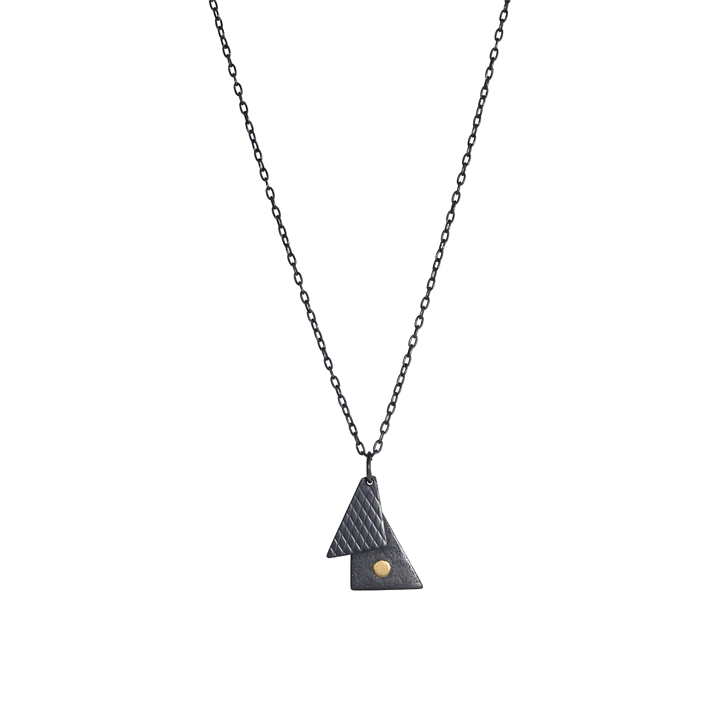 Oxidized argentium sterling silver and 18K gold charm pendant necklace with contemporary geometric styling in a layered look.