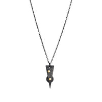 Oxidized argentium sterling silver and 18K gold charm pendant necklace with contemporary geometric styling in a layered look.