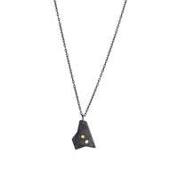 Oxidized argentium sterling silver and 18K gold charm pendant necklace with contemporary geometric styling in a layered look.