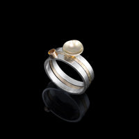 One-of-a-kind, three ring stacking set comprised of a sterling silver band with a 14k gold cup element, a 14k gold band, and a sterling silver band with an 8mm golden citrine set in 14k gold.  