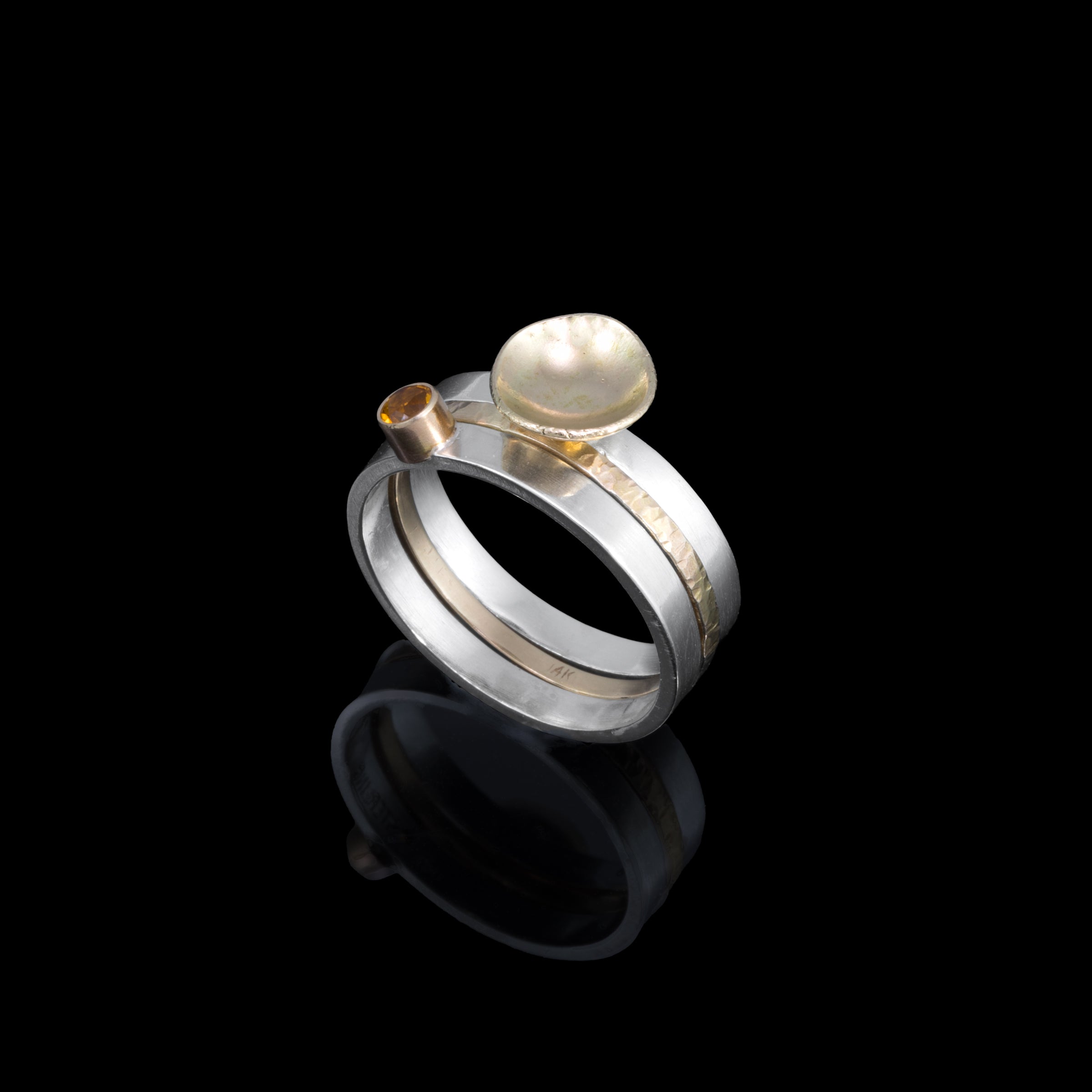 One-of-a-kind, three ring stacking set comprised of a sterling silver band with a 14k gold cup element, a 14k gold band, and a sterling silver band with an 8mm golden citrine set in 14k gold.  