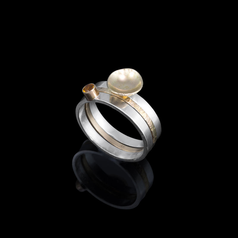One-of-a-kind, three ring stacking set comprised of a sterling silver band with a 14k gold cup element, a 14k gold band, and a sterling silver band with an 8mm golden citrine set in 14k gold.  