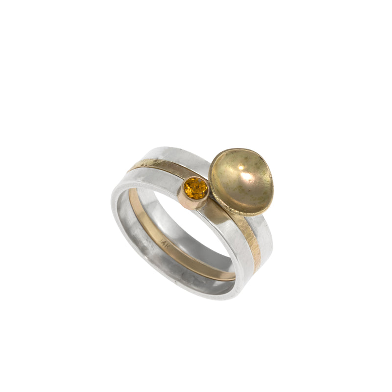 One-of-a-kind, three ring stacking set comprised of a sterling silver band with a 14k gold cup element, a 14k gold band, and a sterling silver band with an 8mm golden citrine set in 14k gold.  
