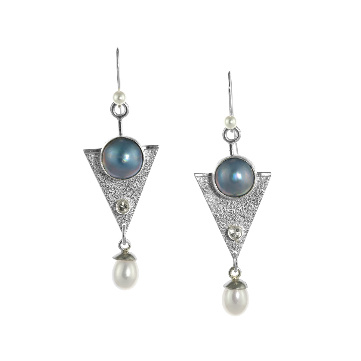One-of-a-kind, dangle earrings in sterling silver featuring 10mm blue Mabe pearls, 4mm white topaz and 6mm white freshwater pearl drops.