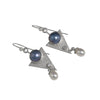 One-of-a-kind, dangle earrings in sterling silver featuring 10mm blue Mabe pearls, 4mm white topaz and 6mm white freshwater pearl drops.