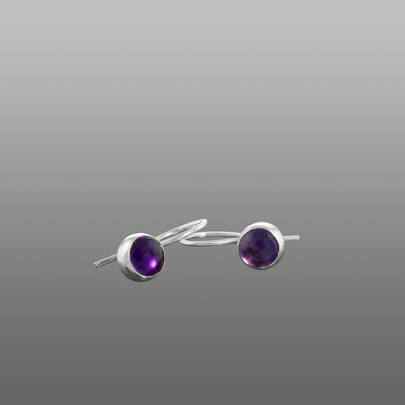 Petite drop earrings handcrafted in fine and sterling silver and set with a colorful stone – amethyst shown (February birthstone).