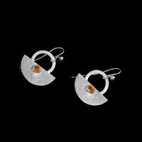 Crescent-shaped earrings handcrafted with Argentium sterling silver and set with Oregon fire opal stones. 