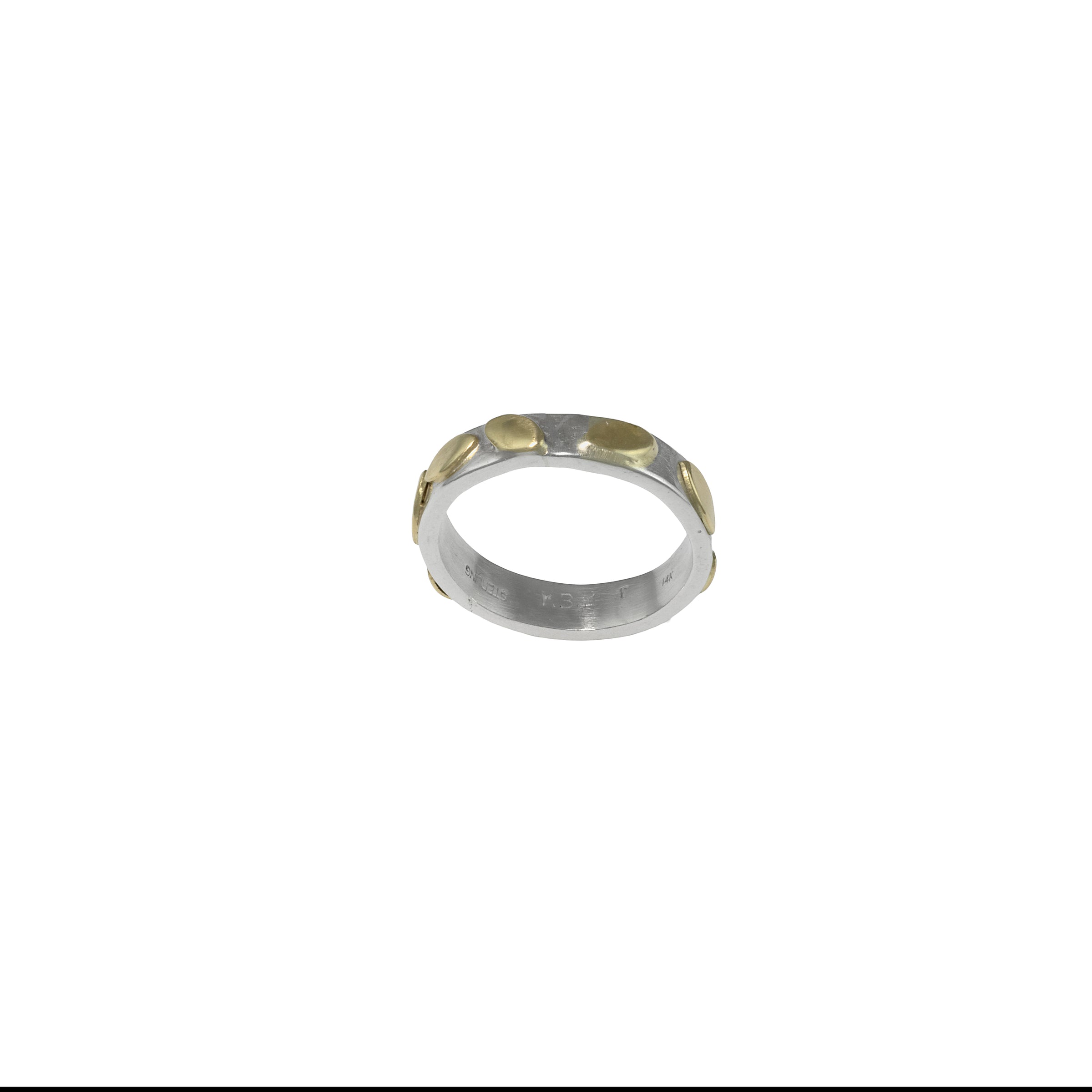 Hand-fabricated, contemporary design ring featuring 14k gold leaves sprinkled around a sterling silver band.