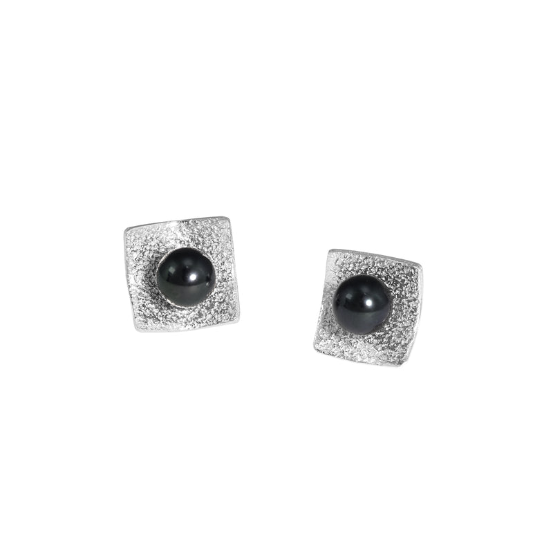 Hand-fabricated, post earrings in sterling silver with 6mm black pearls.