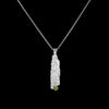 One-of-a-kind pendant necklace.  Handcrafted, organic casting of bark in sterling silver set with a bright green peridot (august birthstone) and hung on a silver rolo chain. 