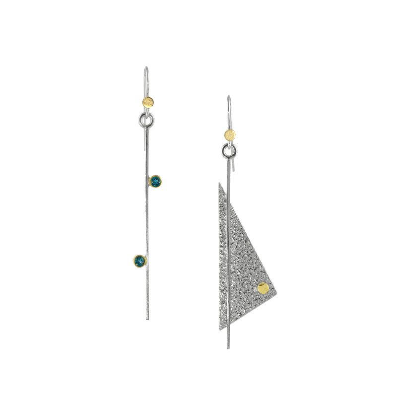 Asymmetrical dangle earrings, handcrafted in Argentium sterling silver with 18K gold accents and blue topaz gemstones set in 18K gold bezels.  December Birthstone.