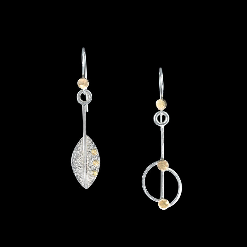Asymmetrical, leaf-themed dangle earrings, hand-fabricated in sterling silver with 14k gold elements.