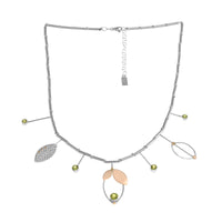 Modern statement necklace, hand-fabricated in sterling silver and featuring five green peridots set with 14k gold leaf pendants and elements.  18” with 2” extender.