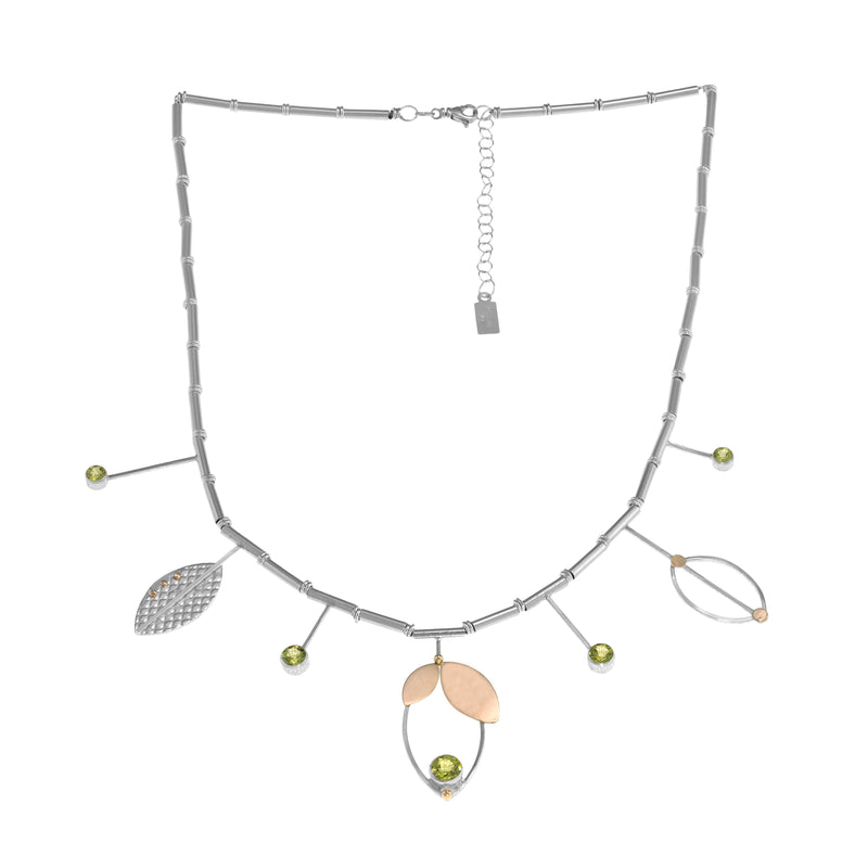 Modern statement necklace, hand-fabricated in sterling silver and featuring five green peridots set with 14k gold leaf pendants and elements.  18” with 2” extender.