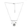 Modern geometric design pendant necklace, handcrafted from Argentium and sterling silver with 18K gold highlights and a London blue topaz set in an 18K gold bezel.