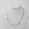 Contemporary, asymmetrical chain necklace, handcrafted in Argentium sterling silver.