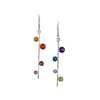 Asymmetrical, sterling silver earrings set with pride-themed faceted stones – pink tourmaline, red garnet, Mexican fire opal, golden citrine, green peridot, sky blue topaz, London blue topaz and purple amethyst.