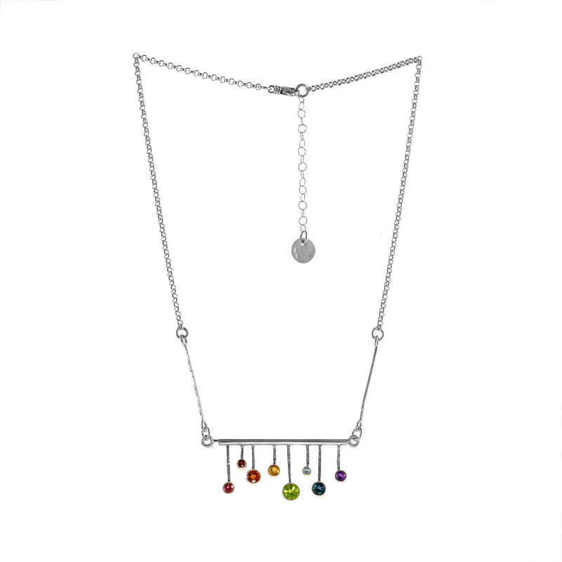 One-of-a-kind, colorful pendant necklace, hand fabricated from Argentium and sterling silver and set with pink tourmaline, Orissa garnet, orange sapphire, citrine, peridot, Swiss Blue topaz, London blue topaz, and amethyst stones.