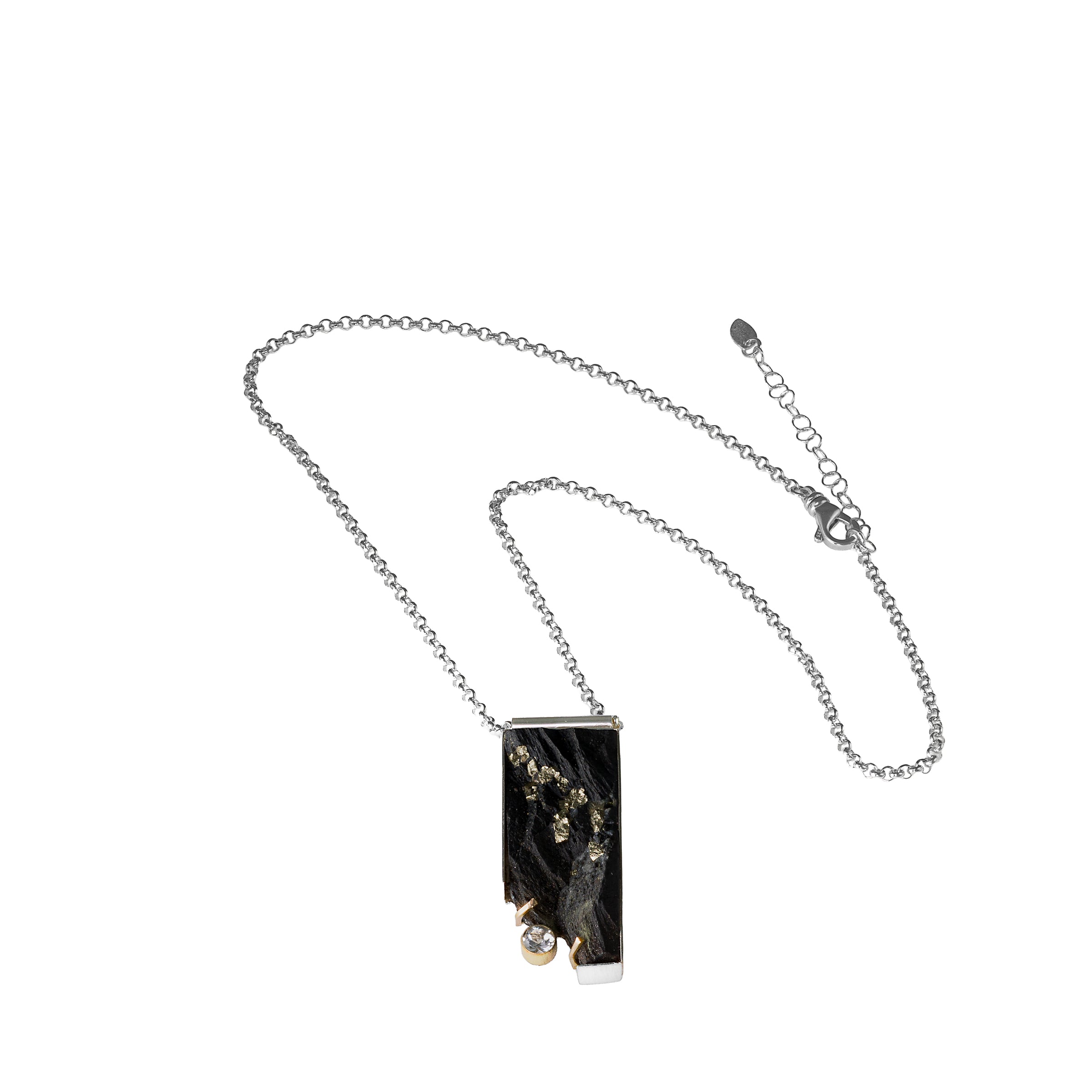 One-of-a-kind pendant necklace featuring a pyrite slab on a sterling silver base and adorned with a white topaz set in 14k gold and additional 14k gold elements.