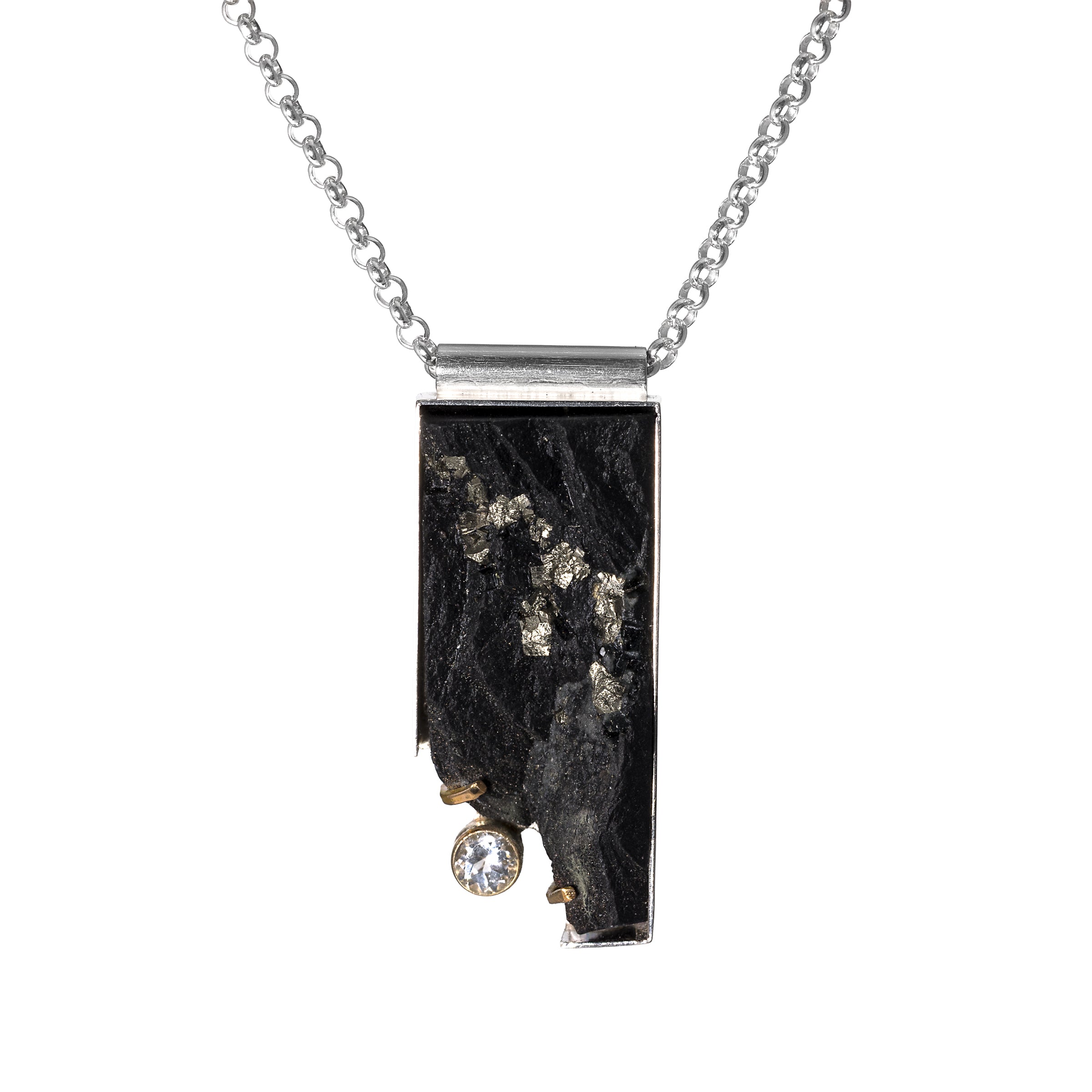 One-of-a-kind pendant necklace featuring a pyrite slab on a sterling silver base and adorned with a white topaz set in 14k gold and additional 14k gold elements.
