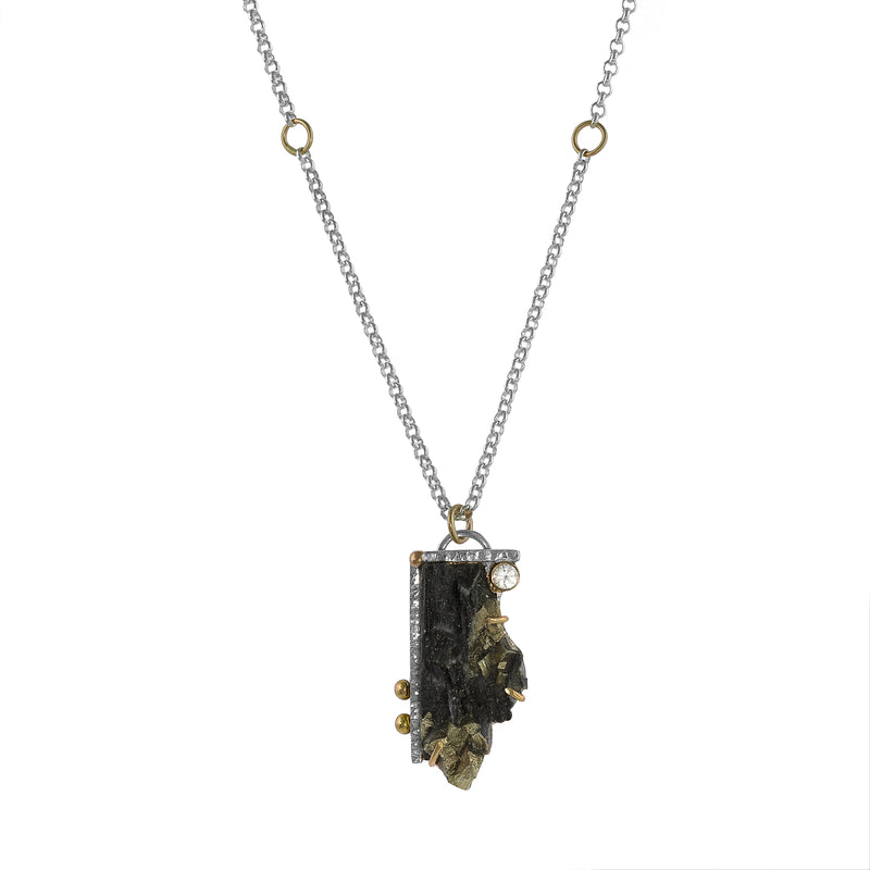 One-of-a-kind pendant necklace, hand fabricated from a large pyrite slab set in sterling silver and accented by a white sapphire and 14K gold elements.  Sterling silver rolo chain.  