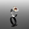 Statement ring hand-fabricated in sterling silver and set with a 6mm red garnet and 14k gold balls.