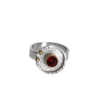 Statement ring hand-fabricated in sterling silver and set with a 6mm red garnet and 14k gold balls.