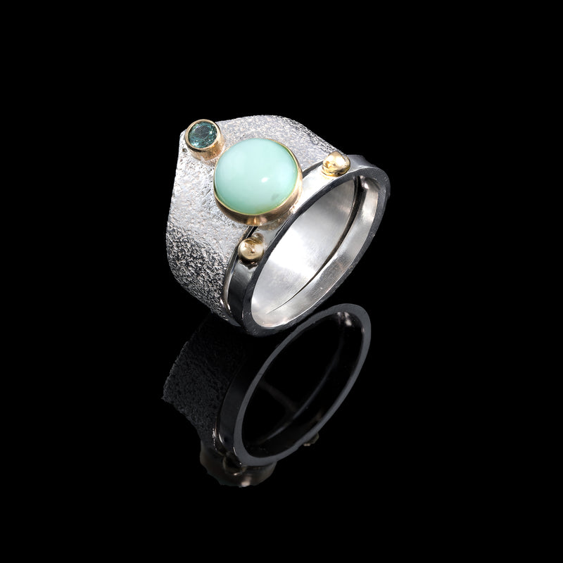 One-of-a-kind ring set, hand fabricated from sterling silver.  Large ring features a green chrysoprase and a mint green tourmaline both set in 14K gold.  Small ring features two 14K gold balls.