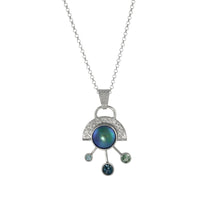 One-of-a-kind, pendant necklace, handcrafted in sterling silver and set with an Abalone Mabe pearl, Swiss blue topaz, London blue topaz and mint green tourmaline gemstones.  Sterling silver rolo chain.