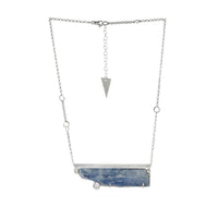 Contemporary, one-of-a-kind pendant necklace, handcrafted from a blade of blue Kyanite, framed in sterling silver and accented by three white topaz stones.  Sterling silver rolo chain.