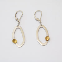 Modern, asymmetrical dangle earrings, handcrafted in Argentium sterling silver with 18K gold accents.