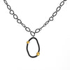 Modern design chain necklace with links individually hand-fabricated from oxidized Argentium sterling silver and 18K gold accents on the pendant.