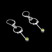 Contemporary dangle earrings, handcrafted in Argentium sterling silver and set with 4mm green peridots (August birthstone).  Sterling silver lever back ear wires.