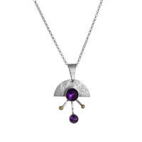 Contemporary sterling silver pendant necklace featuring a 8mm and 5mm purple amethysts set in 14k gold with additional 14K gold elements.  18” chain with 2” extender. 