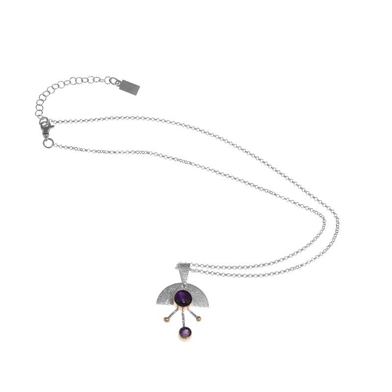 Contemporary sterling silver pendant necklace featuring a 8mm and 5mm purple amethysts set in 14k gold with additional 14K gold elements.  18” chain with 2” extender. 