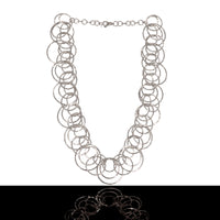 Statement necklace handcrafted from dozens of hammered rings of Argentium sterling silver.