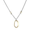 Large 14K yellow gold pendant on an oxidized sterling silver rolo chain highlighted by four smaller 14K gold links.